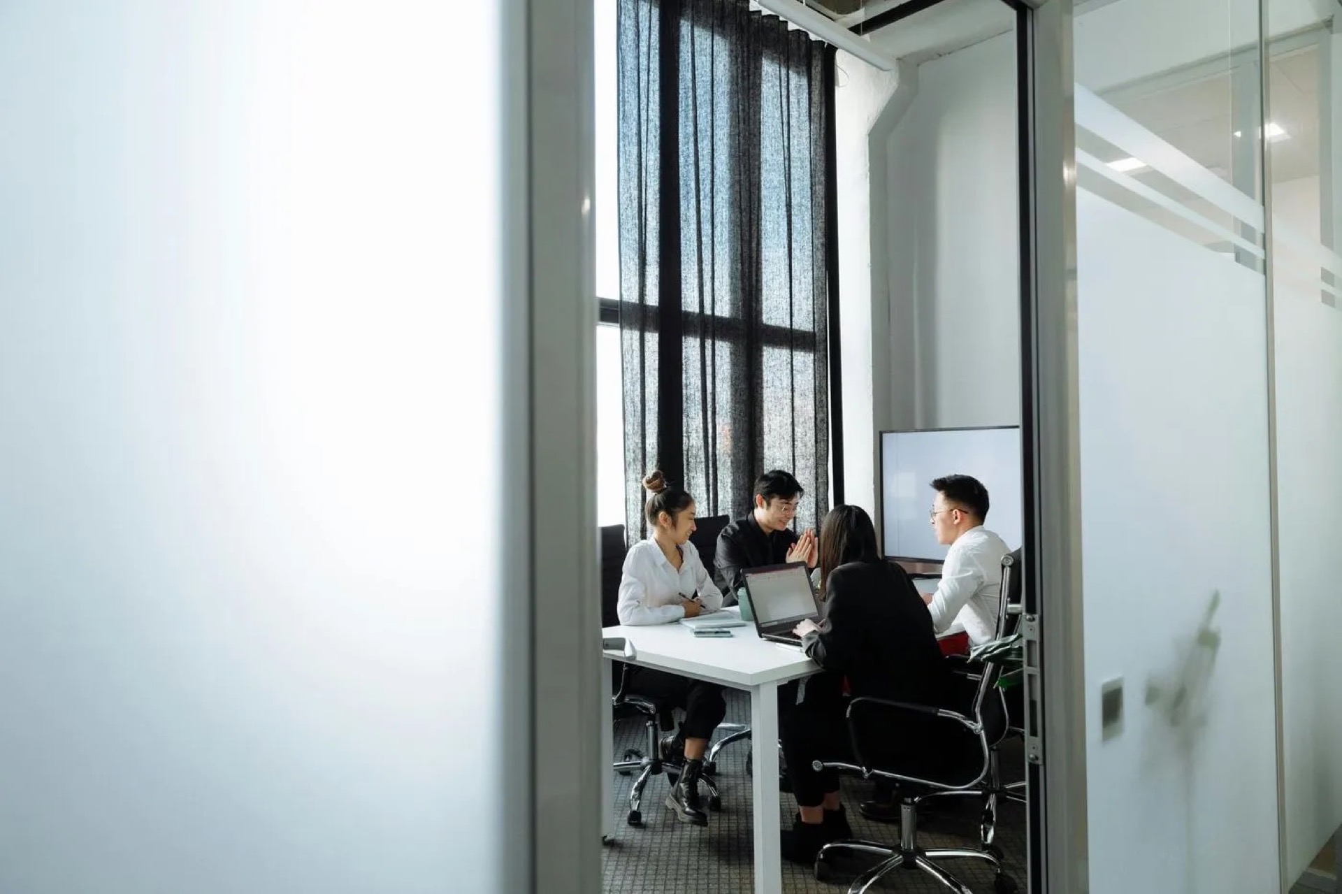 IT professionals collaborating in modern Calgary office